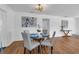 Cozy dining area features hardwood floors and a modern chandelier at 2201 Delaney. Ave, Orlando, FL 32806