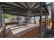 Backyard gazebo with ample seating, gravel area, and shade from mature trees at 2201 Delaney. Ave, Orlando, FL 32806