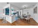 Stylish kitchen with white cabinets, stainless steel appliances, and a breakfast bar area at 2201 Delaney. Ave, Orlando, FL 32806