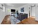 Inviting living room featuring hardwood floors, plush seating, and stylish decor at 2201 Delaney. Ave, Orlando, FL 32806