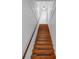 Interior staircase with wooden stairs and white shiplap walls at 2201 Delaney. Ave, Orlando, FL 32806