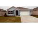 Newly built home with two-car garage and attractive curb appeal at 5120 Tana Ter, Saint Cloud, FL 34773