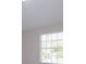 Well-lit bedroom offers a bright and airy atmosphere, enhanced by a large window at 6893 Hidden Glade Pl, Sanford, FL 32771