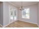 Dining room featuring hardwood floors, crown moulding and a view of the pool at 6893 Hidden Glade Pl, Sanford, FL 32771