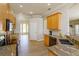 Kitchen featuring granite counters, stainless steel appliances and tile backsplash at 6893 Hidden Glade Pl, Sanford, FL 32771