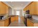 Open kitchen featuring tile backsplash, granite counters, and stainless steel appliances at 6893 Hidden Glade Pl, Sanford, FL 32771