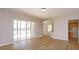 Bright living room with hardwood floors, sliding glass doors to the lanai and view of lake at 6893 Hidden Glade Pl, Sanford, FL 32771
