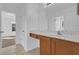 Bathroom featuring vanity with countertop, tile flooring, and a view into another room at 3211 Eagle Watch Dr, Kissimmee, FL 34746
