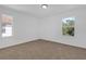 Empty bedroom features neutral carpet, windows with view of the outdoors at 3211 Eagle Watch Dr, Kissimmee, FL 34746
