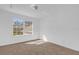 Bright bedroom with neutral carpet, offering ample natural light from a large window at 3211 Eagle Watch Dr, Kissimmee, FL 34746