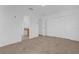 Spacious bedroom featuring neutral carpet, a double door closet, and an ensuite bath for added convenience at 3211 Eagle Watch Dr, Kissimmee, FL 34746