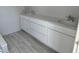 Bathroom featuring a double sink vanity with white cabinetry and quartz countertop at 9332 Bolshoi Aly, Winter Garden, FL 34787