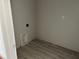 Laundry room with gray walls and tiled floors, ready for appliances at 9332 Bolshoi Aly, Winter Garden, FL 34787