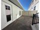 Charming paved patio area enclosed by a privacy fence, perfect for outdoor relaxation at 9332 Bolshoi Aly, Winter Garden, FL 34787