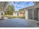 A view of the backyard with a storage shed and patio space at 1009 Perkins St, Leesburg, FL 34748