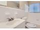 Bright bathroom with white tile, modern fixtures, and a clean, minimalist design at 1009 Perkins St, Leesburg, FL 34748