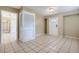 Inviting foyer with tiled floors, a bright white front door and closet space, creating a welcoming atmosphere at 1009 Perkins St, Leesburg, FL 34748