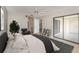 Relaxing bedroom with a ceiling fan, sliding glass doors, and ensuite bathroom at 11 Escondido Cir # 109, Altamonte Springs, FL 32701