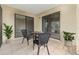 A cozy patio area includes an outdoor table set and sliding glass doors to the interior at 11 Escondido Cir # 109, Altamonte Springs, FL 32701