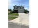 Charming two-story home featuring a well-manicured lawn and a two-car garage, perfect for Gathering living at 1952 Dunn Cove Dr, Apopka, FL 32703