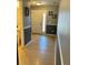 Inviting hallway with tile flooring leading to a bright front door, complemented by decorative wall accents at 1952 Dunn Cove Dr, Apopka, FL 32703