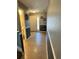 Inviting hallway with tile flooring leading to a bright front door, complemented by decorative wall accents at 1952 Dunn Cove Dr, Apopka, FL 32703