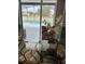 View of the pool and backyard through a glass dining table at 1952 Dunn Cove Dr, Apopka, FL 32703