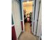Walk-in closet with white trim, red accent, and shelving for maximum storage at 1952 Dunn Cove Dr, Apopka, FL 32703
