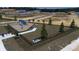 Aerial view of a new community featuring a playground and park benches at 371 Lady Palm St, Apopka, FL 32703