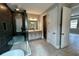 Bathroom with walk-in shower, double vanity, and gray tile at 371 Lady Palm St, Apopka, FL 32703
