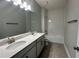 Modern bathroom with double vanity and shower/tub combo at 371 Lady Palm St, Apopka, FL 32703