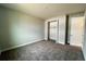 Well-lit bedroom with carpet flooring and walk-in closet at 371 Lady Palm St, Apopka, FL 32703