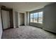 Bright bedroom featuring carpet flooring and a large window at 371 Lady Palm St, Apopka, FL 32703