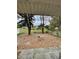 Spacious backyard featuring mature trees and a partially fenced perimeter at 6776 Brittany Chase Ct, Orlando, FL 32810