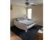 Bedroom featuring a ceiling fan, window, and ample natural light at 6776 Brittany Chase Ct, Orlando, FL 32810