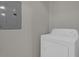 Laundry room area with a standard white washing machine at 14304 Fredricksburg Dr # 420, Orlando, FL 32837