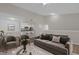 Open living room showcasing luxury vinyl flooring, open concept floorplan, and a modern brick accent wall at 14304 Fredricksburg Dr # 420, Orlando, FL 32837