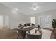 Neutral living room with vaulted ceiling, ceiling fan, modern furniture, and a sliding glass door at 14304 Fredricksburg Dr # 420, Orlando, FL 32837