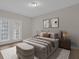 Bright main bedroom boasting a full bed, lanai access, and contemporary decor at 14304 Fredricksburg Dr # 420, Orlando, FL 32837
