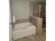 Bathroom featuring a tiled shower, a bathtub, and neutral-toned tile flooring at 14501 Grove Resort Ave # 1332, Winter Garden, FL 34787