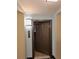 A dark brown door with the number 1332 on the wall next to it at 14501 Grove Resort Ave # 1332, Winter Garden, FL 34787