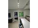 Living space featuring modern decor, including an art piece, seating and an entryway to the bedroom at 14501 Grove Resort Ave # 1332, Winter Garden, FL 34787