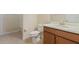 Bathroom with wood vanity, single sink, and shower/tub combo at 2871 Sandy Cay St, Clermont, FL 34711