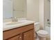 Clean bathroom with wood vanity, single sink, and bathtub at 2871 Sandy Cay St, Clermont, FL 34711