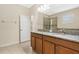 Double vanity bathroom with granite countertop at 2871 Sandy Cay St, Clermont, FL 34711