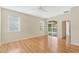 Bedroom with sliding doors to patio and wood floors at 2871 Sandy Cay St, Clermont, FL 34711