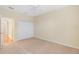 Spacious bedroom with neutral carpeting and double-door closet at 2871 Sandy Cay St, Clermont, FL 34711