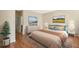 Spacious bedroom with a large bed and dresser at 2871 Sandy Cay St, Clermont, FL 34711