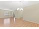 Bright dining room with hardwood floors and chandelier at 2871 Sandy Cay St, Clermont, FL 34711