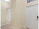 Bright entryway with neutral walls, carpet flooring, and coat closet at 2871 Sandy Cay St, Clermont, FL 34711